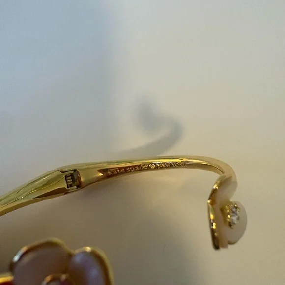 Kate Spade Gold-Tone Open Cuff Bracelet with Cream Flower Accents - Picture 3 of 3